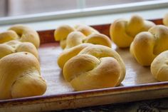 freshly baked rolls on a baking sheet ready for the oven to bake in the oven