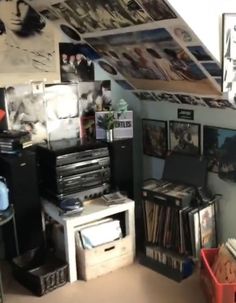 a room filled with lots of clutter and pictures