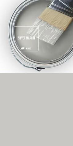 a paint can with a brush in it and the words silver marlin on it