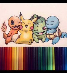 some colored pencils are next to a drawing of pokemon and pikachu characters