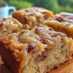 two pieces of cake sitting on top of a wooden cutting board