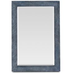 a blue framed mirror on a white wall