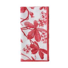 a red and white napkin with flowers on it