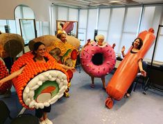 some people are holding giant inflatable objects