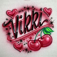 a white shirt with cherries and the word vivre written in black ink on it