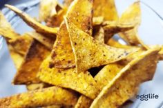 a glass plate filled with tortilla chips