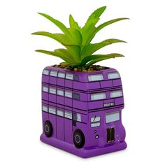 a purple double decker bus planter with a succulent in it