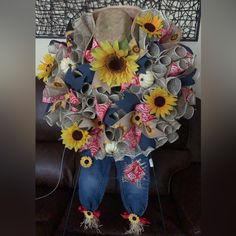 a bouquet of sunflowers is sitting on a chair