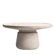 a white marble table with a circular base