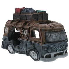 an old toy car with luggage on the roof