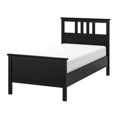 a black bed frame with white sheets on top and bottom, in front of a white background