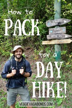 a man standing in front of a sign that says how to pack for a day hike