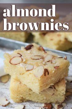 almond brownies stacked on top of each other with the words almond brownies above them