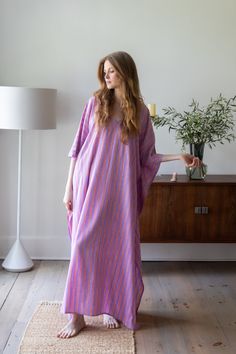 A highly versatile, chic caftan created for today's modern woman. This breezy garment will take you from vacation as the ideal coverup at the pool or beach, then out to dinner in the evening - simply add a clutch and sandals. Or, wear it around the house for a comfortable take on a house dress. We love it for hosting dinner parties! Ideal for pregnant women, new moms, and women of all ages, shapes and sizes. 54 inches length 100% Rayon Block-printed using natural dyes Made in India Removable dou Chic Pink Kaftan For Beach Cover-up, Chic Tunic Kaftan For Vacation, Elegant Summer Kaftan For Vacation, Elegant Summer Vacation Kaftan, Breezy Spring Kaftan, Spring Summer Daywear Kaftan, Chic Long Kaftan For Beach, Spring Beachwear Maxi Tunic, Spring Maxi Length Beachwear Tunic