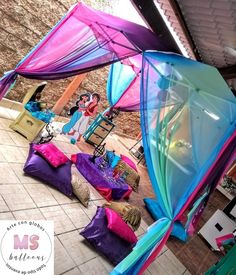 colorful tents set up in the middle of a courtyard