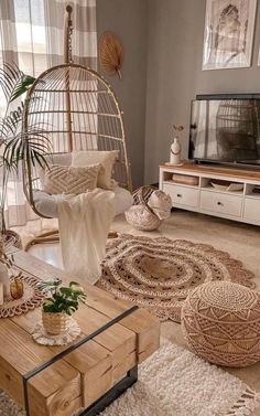 a living room filled with lots of furniture and decor on top of carpeted flooring