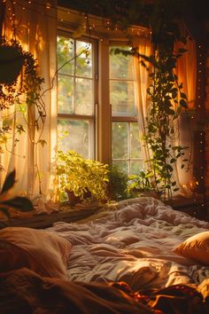 an unmade bed in front of a window filled with plants