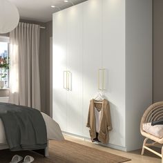 a bedroom scene with focus on the bed and closet