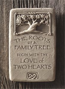 a stone plaque that says the roots of a family tree begin with the love of two hearts