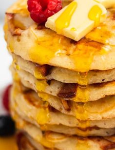 a stack of pancakes topped with butter and syrup