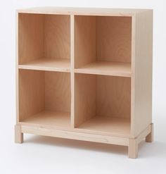 a wooden shelf with three compartments on each side