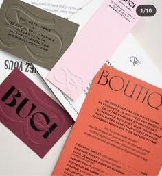 three different types of business cards on top of each other with the word boutique printed on them