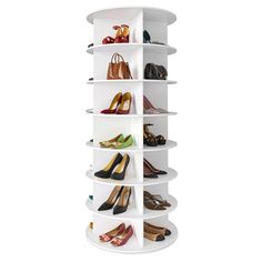 a white round shelf with several pairs of shoes on top and one pair of heels in the bottom