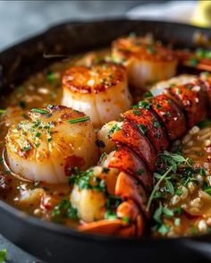 shrimp and grits in a skillet with garnish