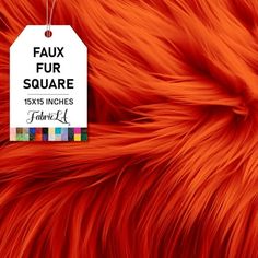 an orange fur with a white tag hanging from it's center and the words faux fur square below