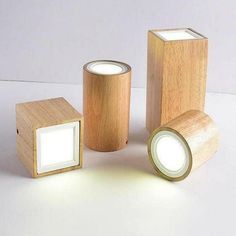 three wooden boxes with lights on them sitting next to each other