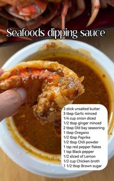 a hand holding a piece of food over a bowl of soup with instructions on how to make seafood dipping sauce