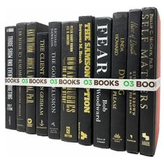 a row of black books sitting on top of each other