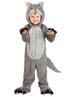 a little boy dressed in a cat costume