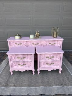 two pink dressers sitting on top of a rug