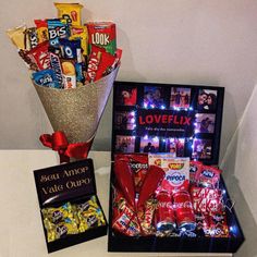 a vase filled with candy and candies next to a box of loveflix