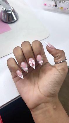 Stiletto Bow Nails, Azlia Williams Nails, Stellos Nails Design, Prom Nails Stiletto, Stiletto Junk Nails, Dope Nail Designs Almond, Pointy Nails Short, Almond Nails With Charms, Nails With Almond Shape