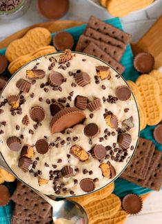 an overhead view of a dessert in a glass bowl with chocolate chips and peanut butter on top