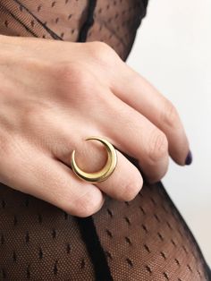 This ring is a piece from Keras collection.Sculptured and casted in solid sterling silver 925 and then double gold plated with 22k gold.Very nice and important weight. The crescent is 20mm (0.787 inch) All of my jewelry is handmade please allow for small variances from piece to piece ,as this is a feature of owning one of a kind original handmade jewelry. Feel free to ask me for personal orders . -22k gold platted Sterling silver 925 You may also like on bright silver https://www.etsy.com/listin Celestial Gold Crescent Rings, Minimalist Crescent Moon Charm Ring, Celestial Crescent Gold Rings, Gold Celestial Moon Ring, Elegant Crescent Moon Charm Rings, Gold Sterling Silver Ring With Moon Charm, Gold Moon Charm Promise Ring, Handmade Gold Moon Shaped Ring, Handmade Moon-shaped Gold Ring