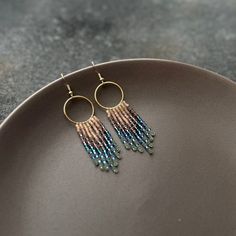 These beaded hoops earrings with shimmering fringe are made of high quality Czech beads. They are lightweight and comfortable. These beaded earrings are an amazing gift for special occasions: holidays, birthdays, anniversaries, Christmas, Valentine's Days and more. It can also be jewelry for the bride or bridesmaids at a boho wedding. This pair is a mix of ethnicity and modern casual style. I create for women who love to feel completely different.  -------------------------------------------- ✦ Boho Earrings Diy, Handwoven Earrings, Dangle Earrings Boho, Handmade Jewelry Diy, Beaded Fringe, Beaded Hoop Earrings, Light Weight Earrings, Fringe Earrings, Diy Earrings