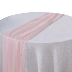 a round table with a pink and white stripe on it