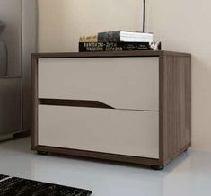 a white and brown nightstand with books on top