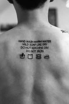 the back of a man's neck with words written on his chest and an inscription that reads, hand wash warm water mild soap like dry do not machine dry do not iron