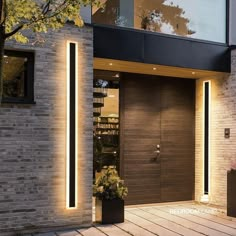 the entrance to a modern home is lit up with leds and lights on it