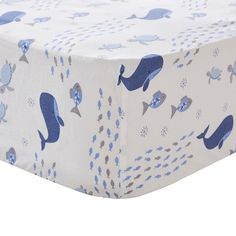 a blue and white whale print fitted sheet