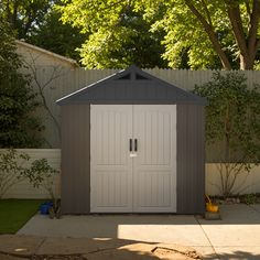 an outdoor storage shed in the backyard