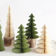 several different types of folded paper trees