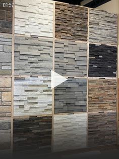 a display case filled with lots of different types of stone tiles and flooring materials