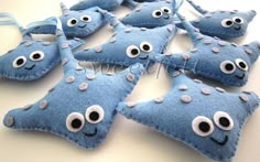 blue felt ornaments with googly eyes on them