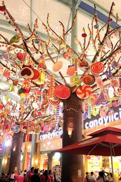 a tree made out of candy canes in a shopping mall