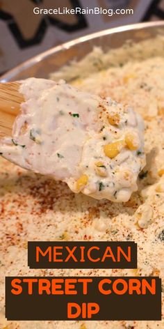 mexican street corn dip with a wooden spoon